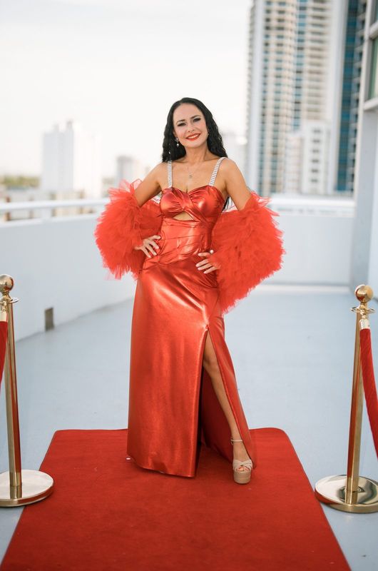 Red satin slip gown with feather wrap