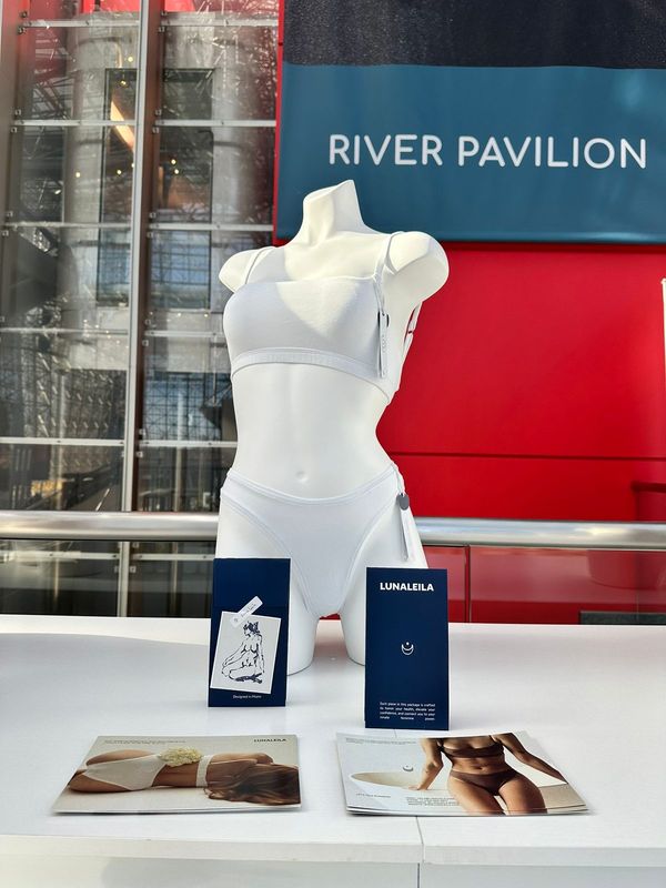 White lingerie set displayed on a form